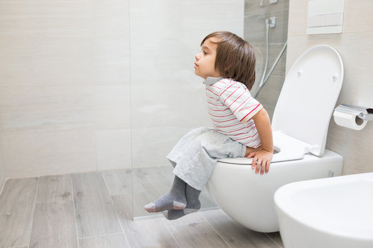Kid at toilet