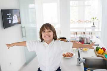 Cute little boy in the modern kitchen
