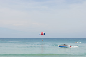 Parasailing on the beach with speed boat in Phuket,Thailand