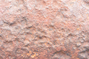 Surface rust in soft light.