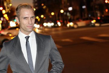 Man walking the city streets at night