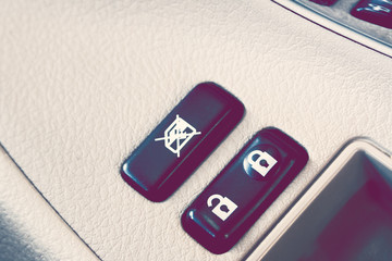 Car door lock button and window lock button with leather beige.