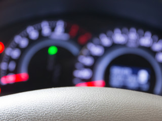 Blurred car dashboard with leather beige.