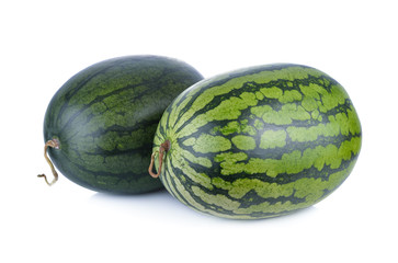 whole ripe red and yellow watermelon with stem on white backgrou