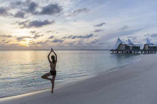 Woman exercise with Yoga on the beach