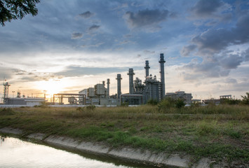 Fototapeta premium Oil and Gas Refinery tower in petrochemical industrial plant with cloudy sky