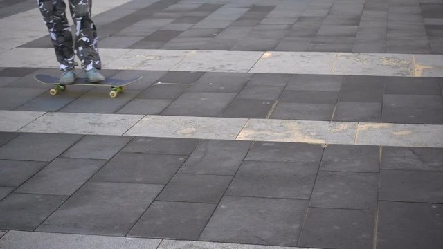 Young boy skating in the city in slow motion