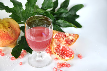 Glass of Fresh Pomegranate Juice with white space for text