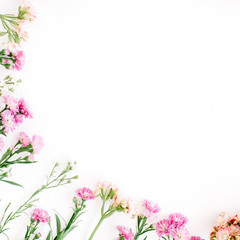 Obraz na płótnie Canvas Colorful wildflowers on white background. Flat lay, top view. Valentine's background
