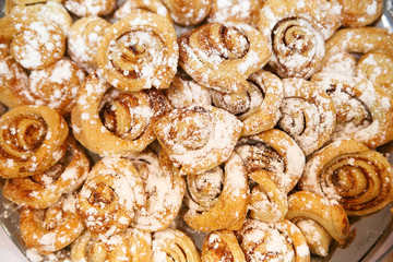 fresh cinnamon rolls sprinkled with vanilla