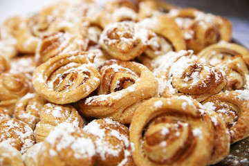fresh cinnamon rolls sprinkled with vanilla