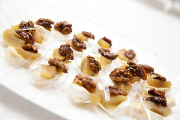 appetizer with cheese and walnuts for buffet on white background