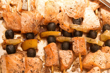 Grilled skewers of salmon. Close up