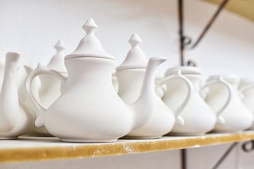 A Row of Turkish Clay Tea Pots on a Shelf