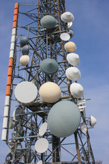 Group of aerials for telecommunications on the mountain top. Electromagnetic and environmental pollution. Linzone mountain pick. Orobie Prealps. Bergamo. Italy