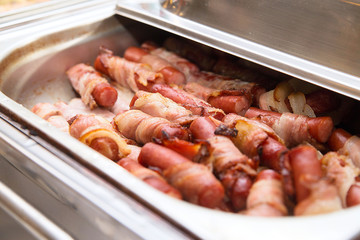 Grilled sausages in heater