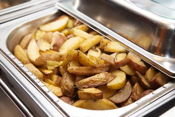  Delicious hot baked potato in banquet heater © ribalka yuli