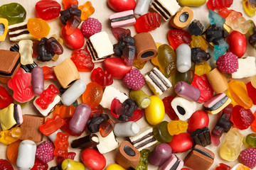 Gummy marmelade candies on old paper background