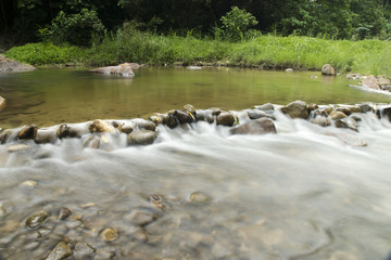 Naklejka na ściany i meble Weir irrigate at Waterfall in tropical forest