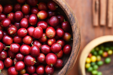 Coffee beans and fresh berries beans background
