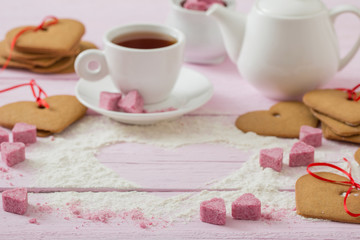 Fototapeta na wymiar cookies heart on pink wooden background