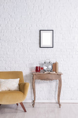 decorative armchair and desk with brick wall and frame