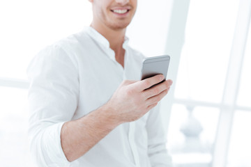 Cropped image of handsome man chatting by phone