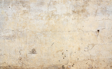 Old stucco wall texture of beige color