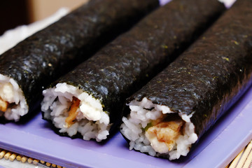 the process of cooking sushi and rolls