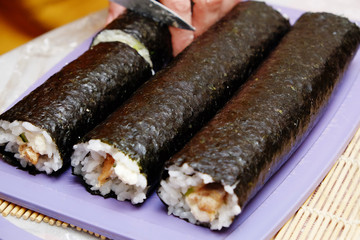 the process of cooking sushi and rolls