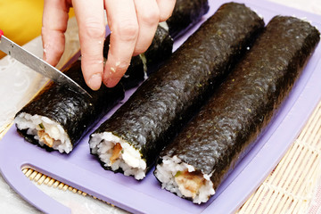 the process of cooking sushi and rolls