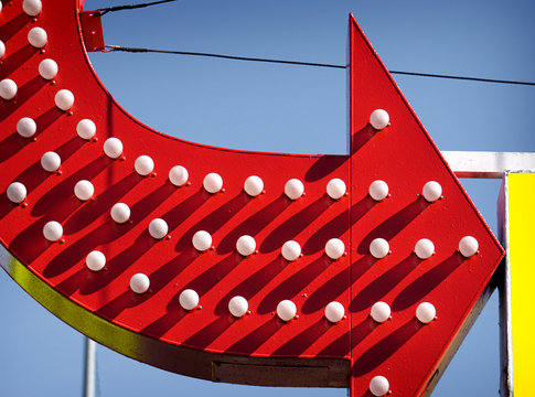 Vintage Red Neon Arrow And Shadows With Blue Sky