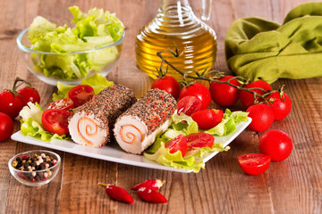 Goat cheese with salad and cherry tomatoes. 