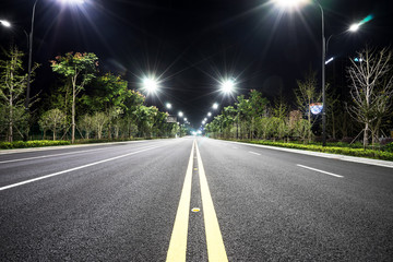 empty asphalt road in suburb of seoul at night