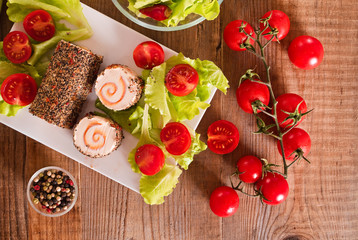 Goat cheese with salad and cherry tomatoes. 