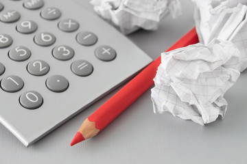 Finances - calculator and red pen