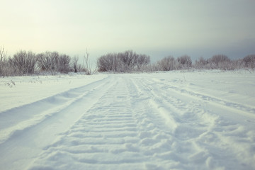 Fototapeta na wymiar winter road snow tracks
