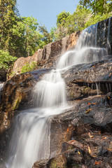 Fototapeta na wymiar Beautiful waterfall cascades in National Park of Thailand.
