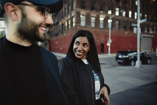 Indian woman with charming broad smile looks at her man somewher