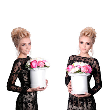 Beautiful blonde woman in elegant black evening dress with updo hairstyle holding a giftbox, bouquet of flowers in her hands. Front and side view. Fashion photo, free space for text.