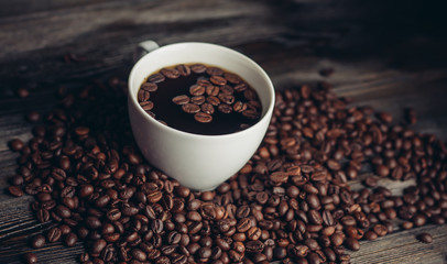 coffee beans, black background, cup, saucer