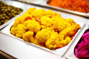 Cooked color yellow cauliflower in metallic dish