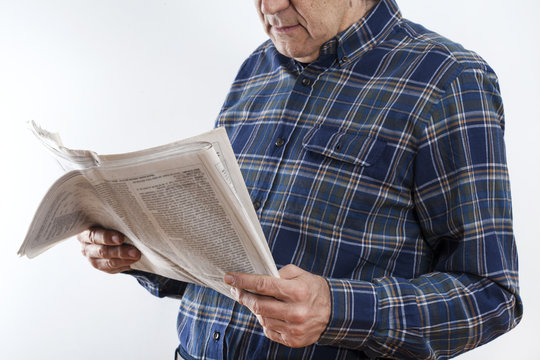 Senior man hands with reading newspaper