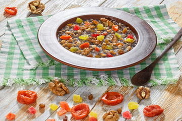 Sweet wheat dessert kutia with ingredients on background