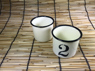 Old tin metal mug and numbers