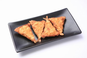 mandu twigim Fried Dumplings on plate