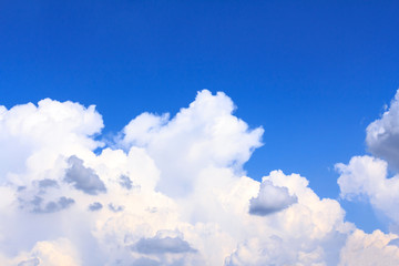 Naklejka na ściany i meble Blue sky background with white clouds and rain clouds on sunny summer or spring day.