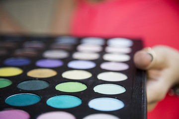 Obraz na płótnie Canvas colorful eyeshadow palette and blush for make-up closeup