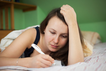 Pretty young brunette woman studying and preparing for her impor
