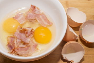 cooking eggs with bacon